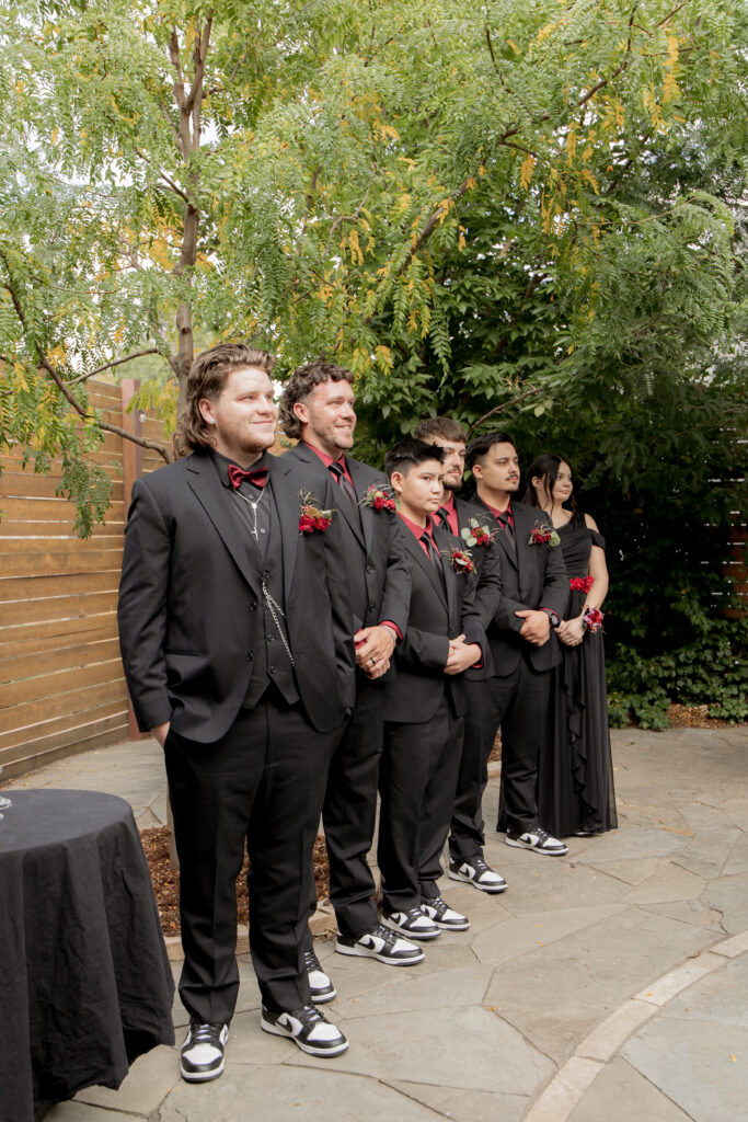 family gathered to witness couple exchanging vows