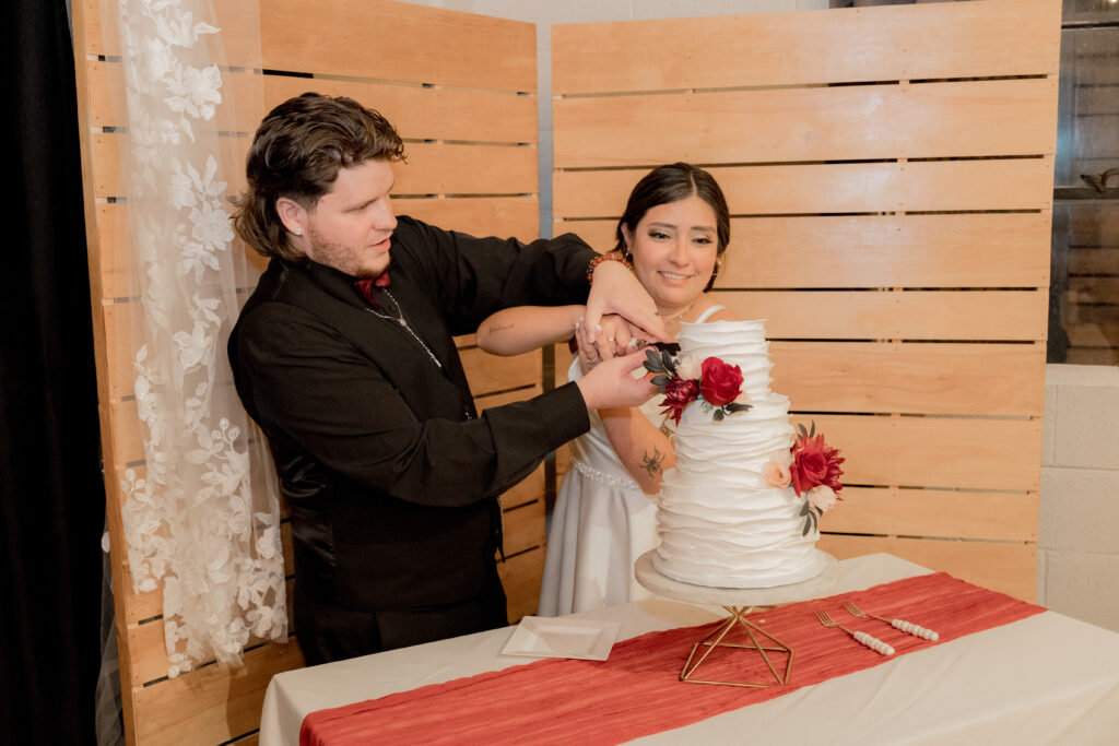 Couple cutting cake