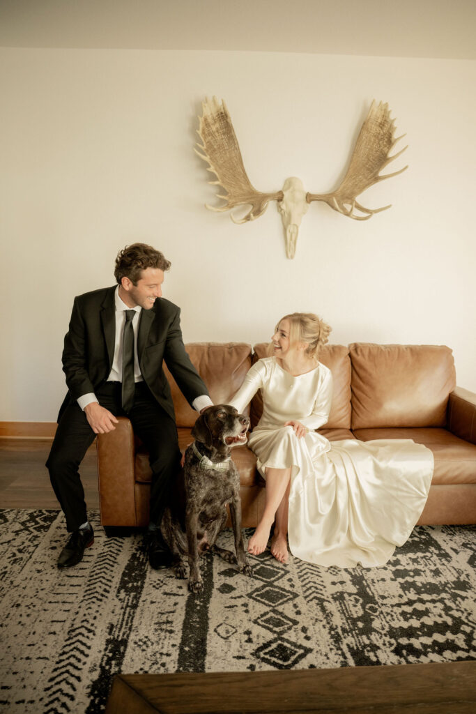 Couple posing with dog