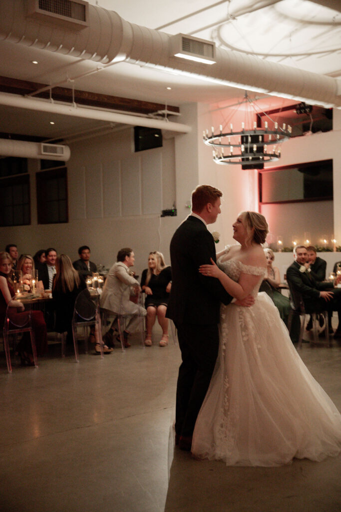 Couple danced under vibrant lights