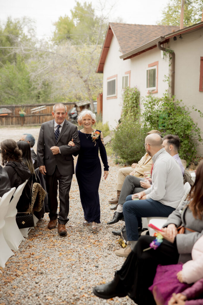 family members walk down the aisle