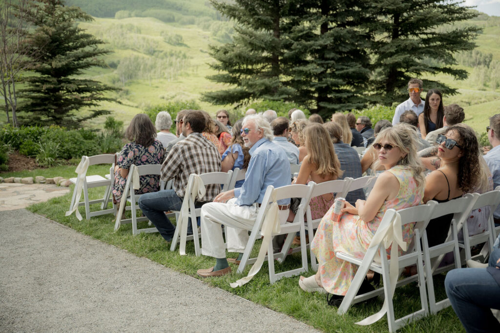 wedding party lined up under trees sunlight