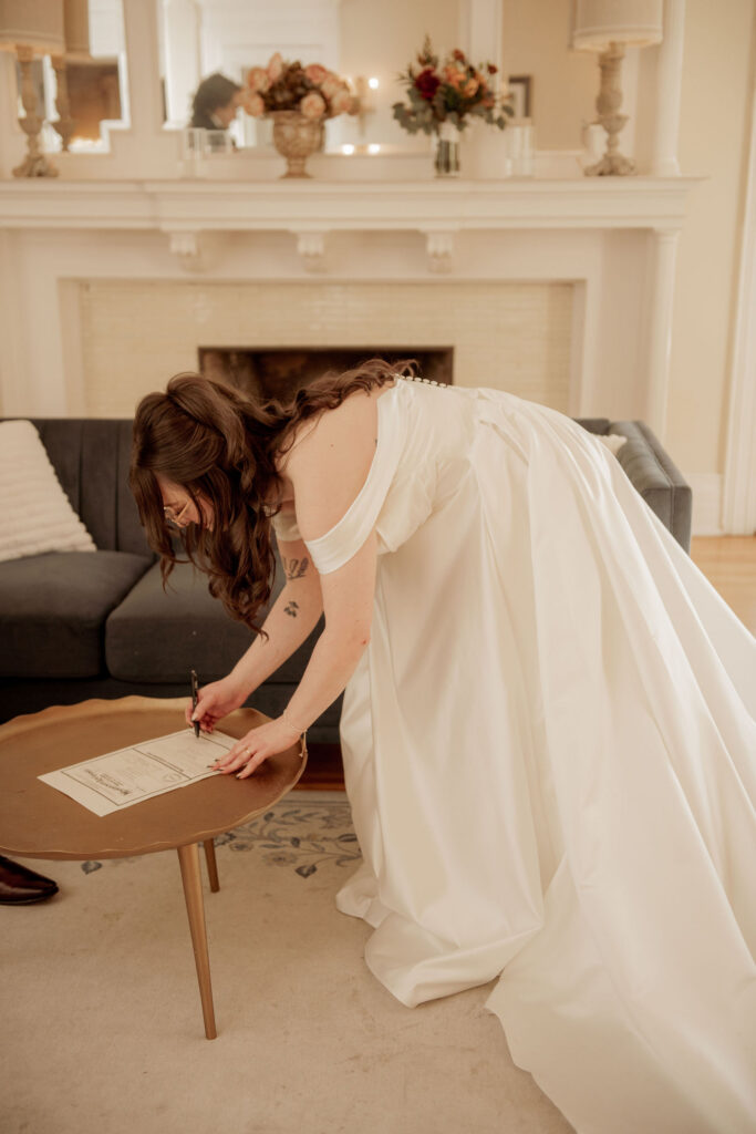 Bride Signing the Marriage License