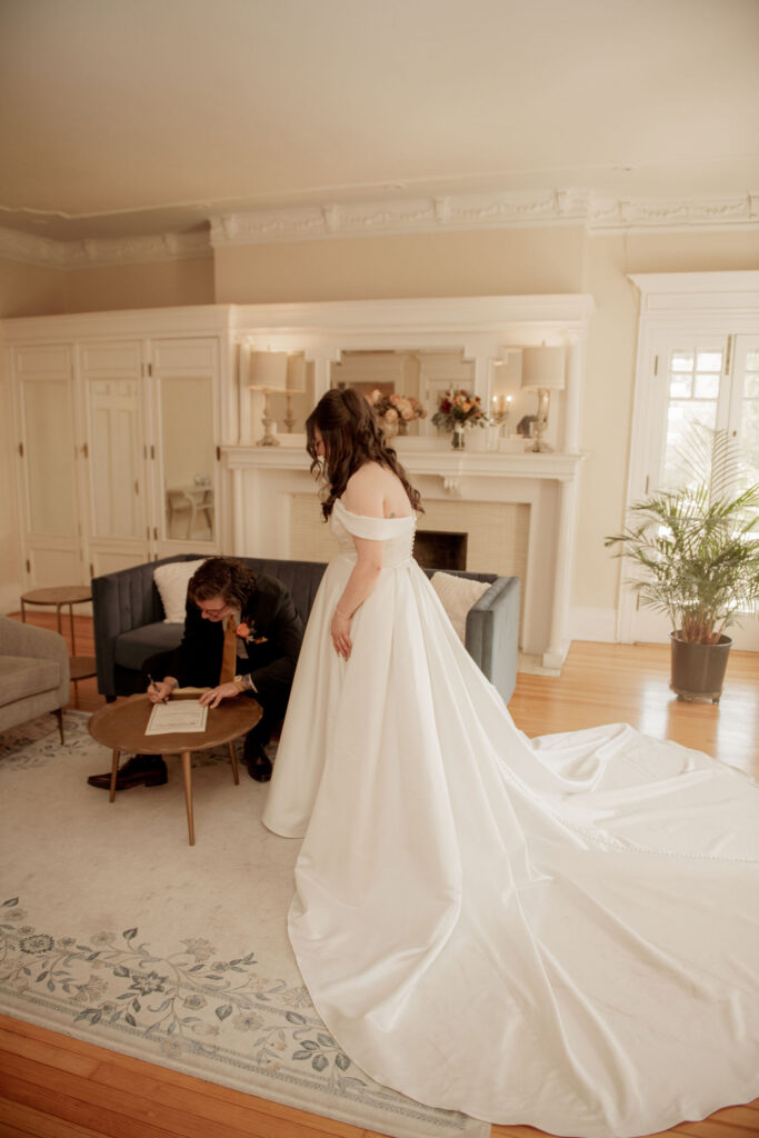 Groom Signing the Marriage License