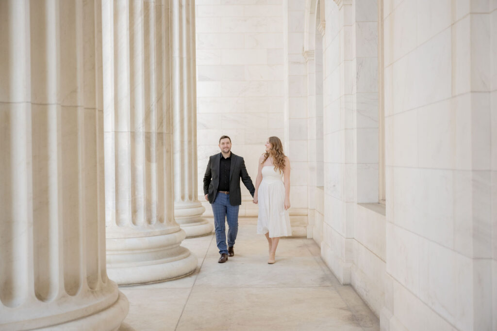 relaxed walk beneath towering columns
