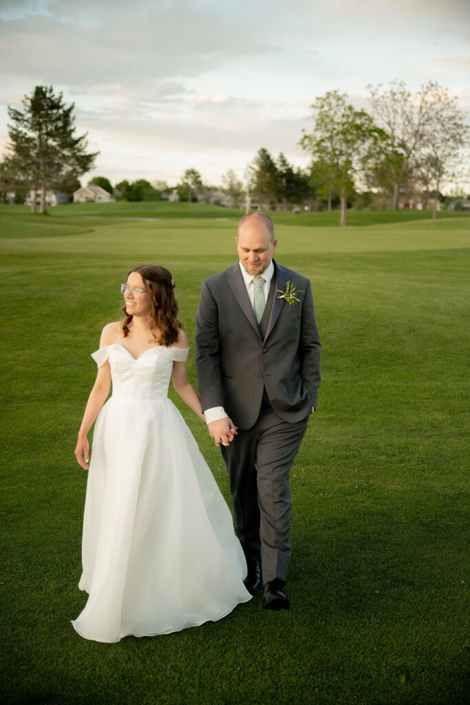 Anna and Patrick walking hands in hands