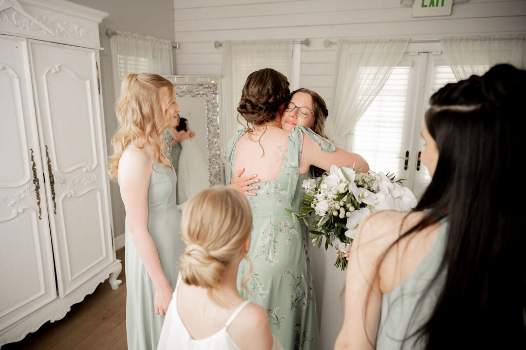 Anna hugs her bridesmaid