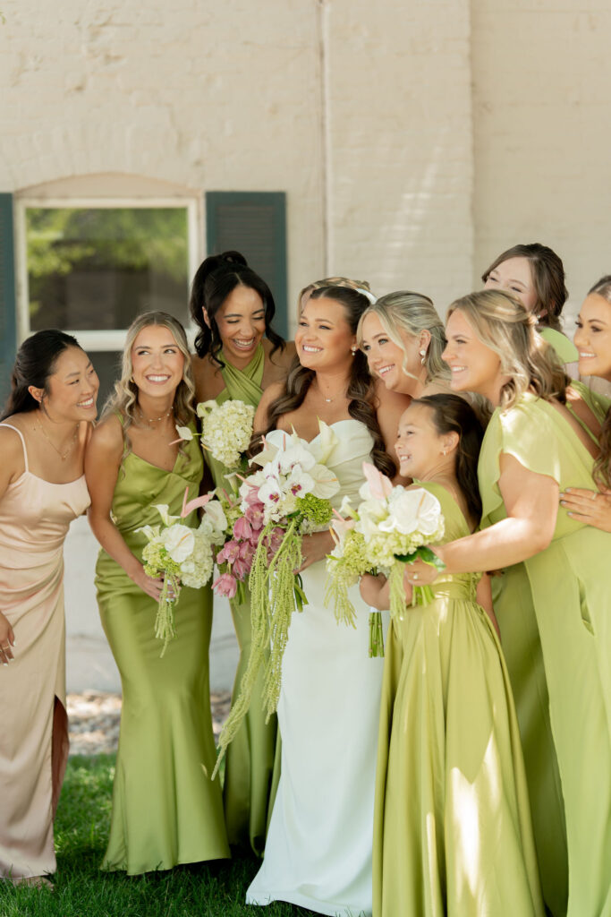 Bride and Her bridesmaids joking and laughing