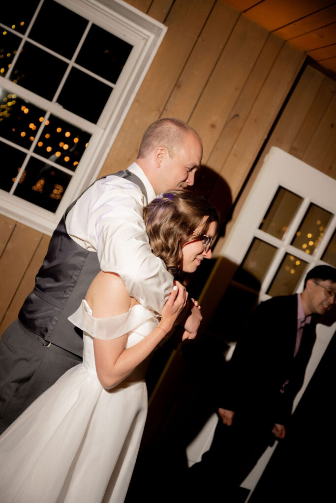 Couple standing holding each other