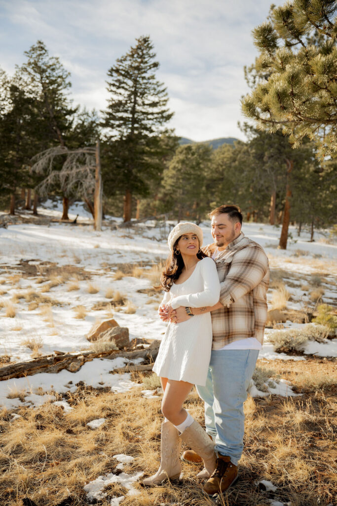 Newly engaged couple smiling together
