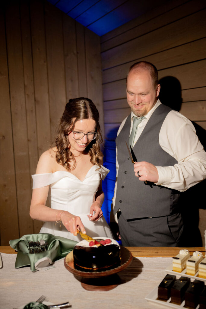 Newly wed couple cutting cake