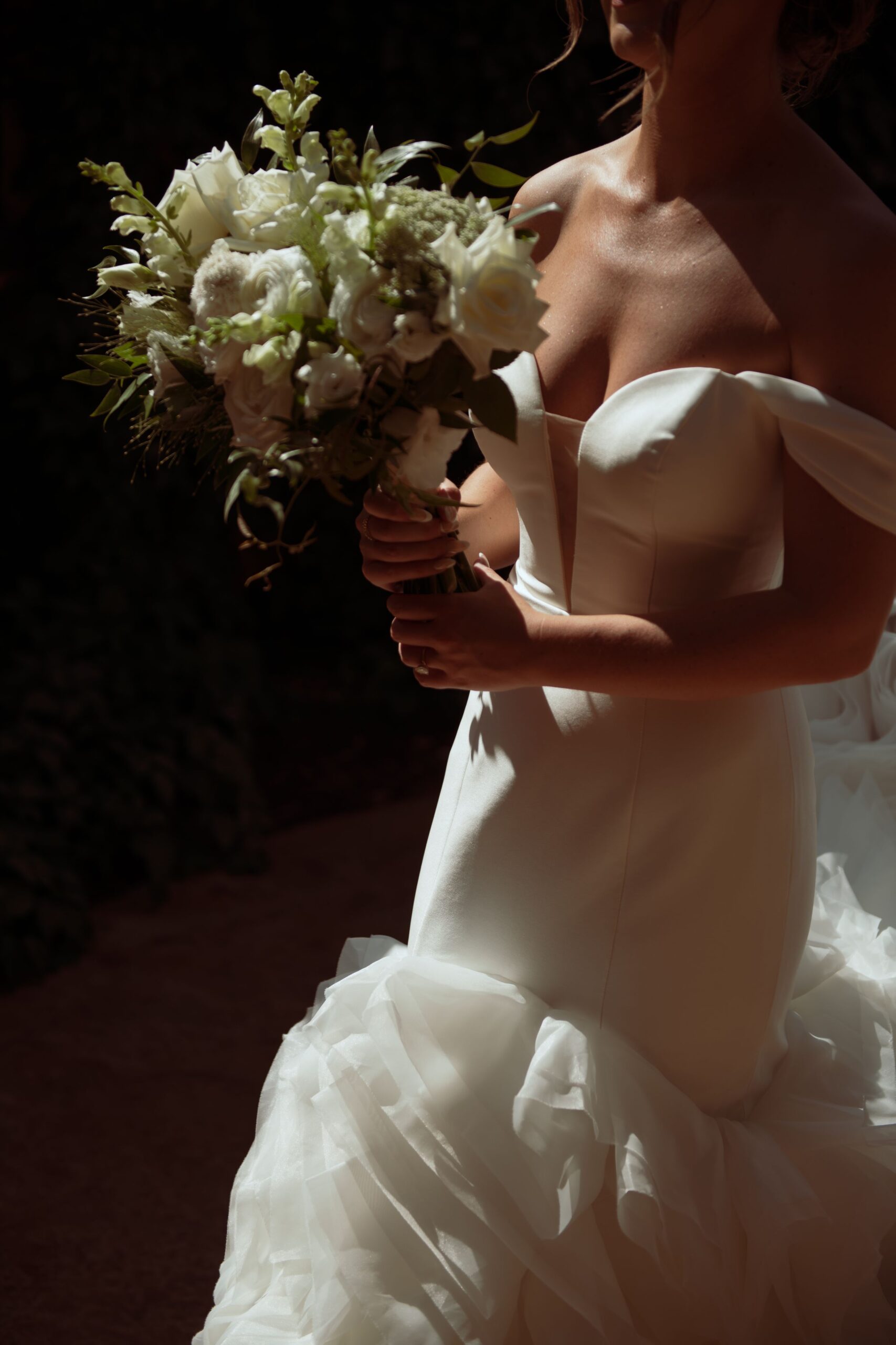 Bride holding a white wedding bouquet