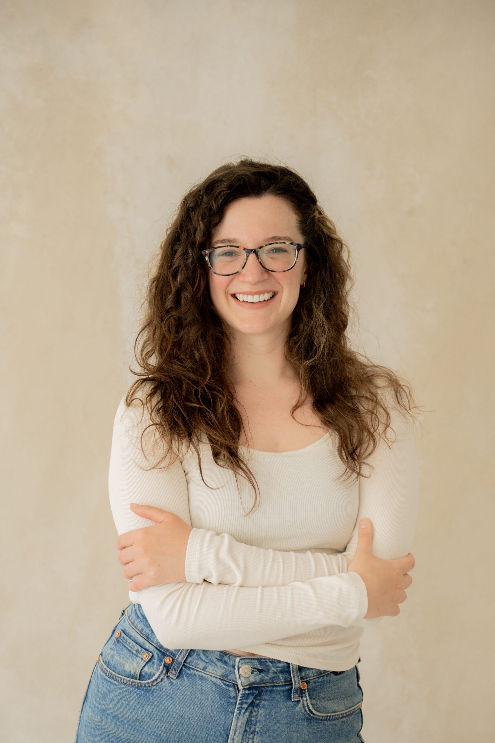 Confident smiling lady with folded arms