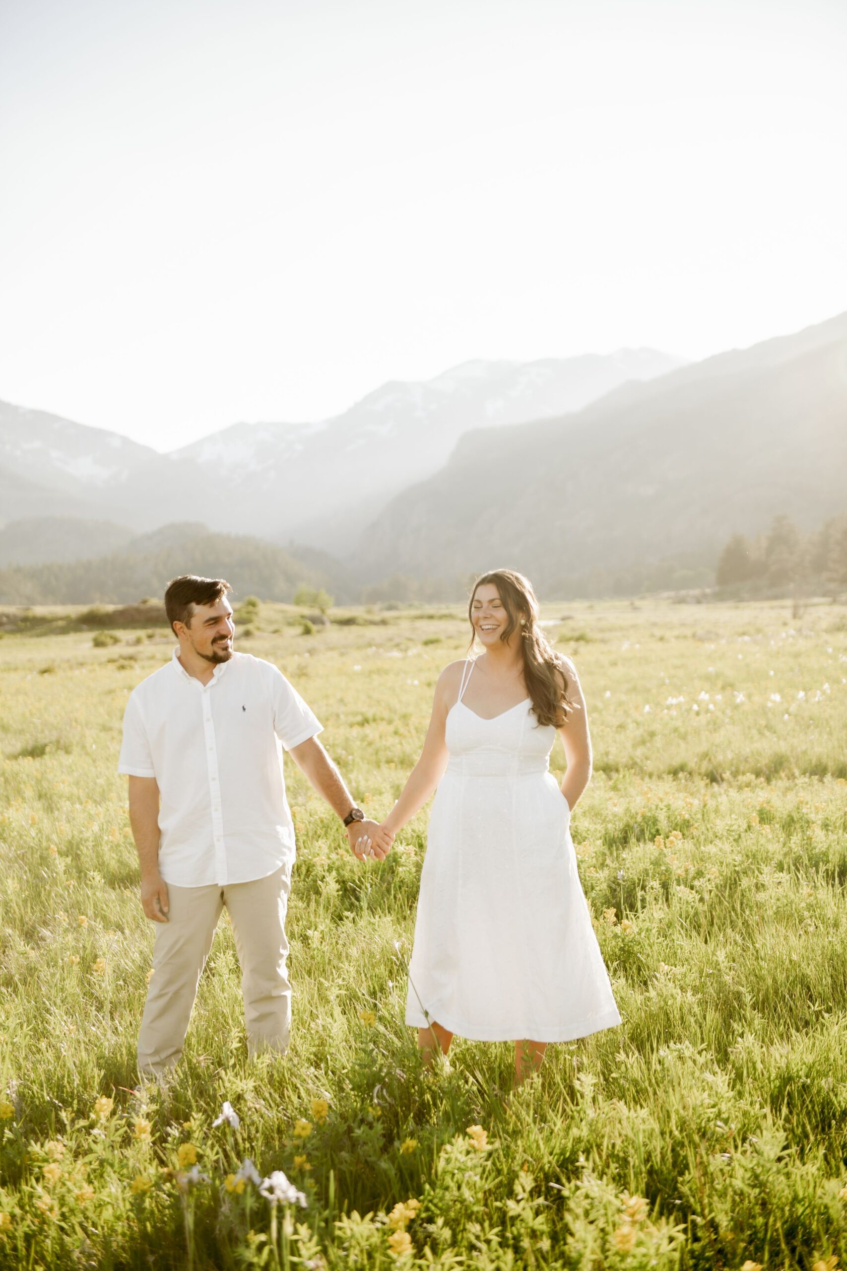 Couple Holding Hands in a Mountain Meadow