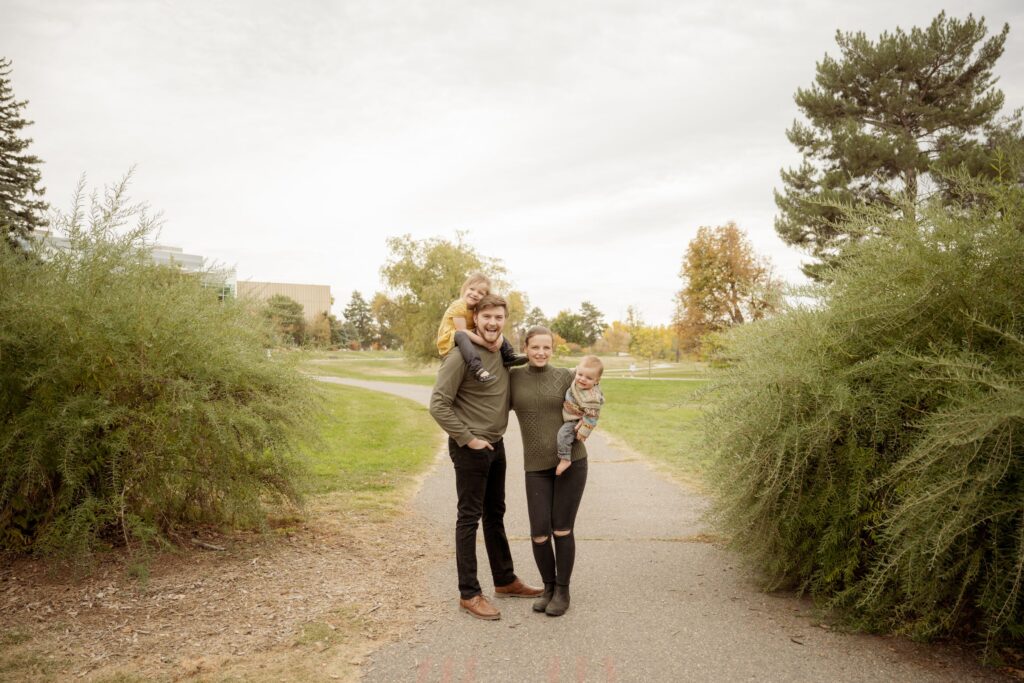 Family portrait on a park path.