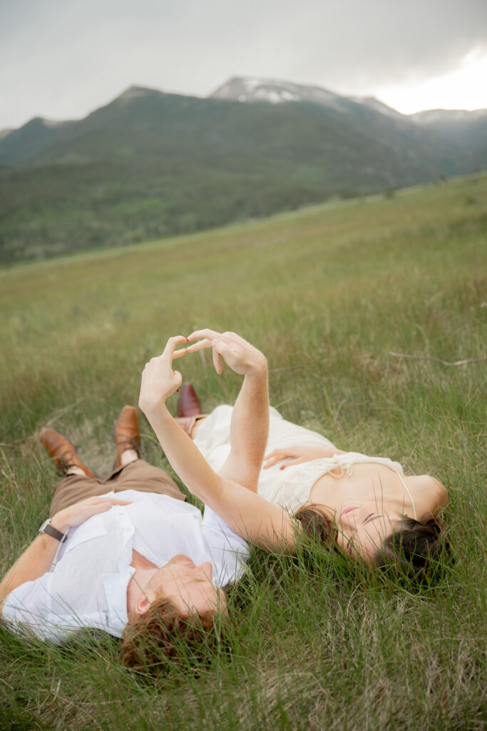 Creative couple poses for Colorado engagement photoshoot