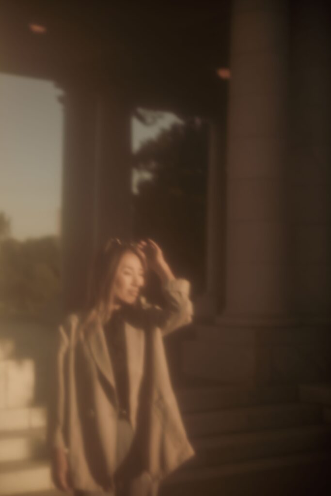 Woman standing outside a historic building during a branding photoshoot