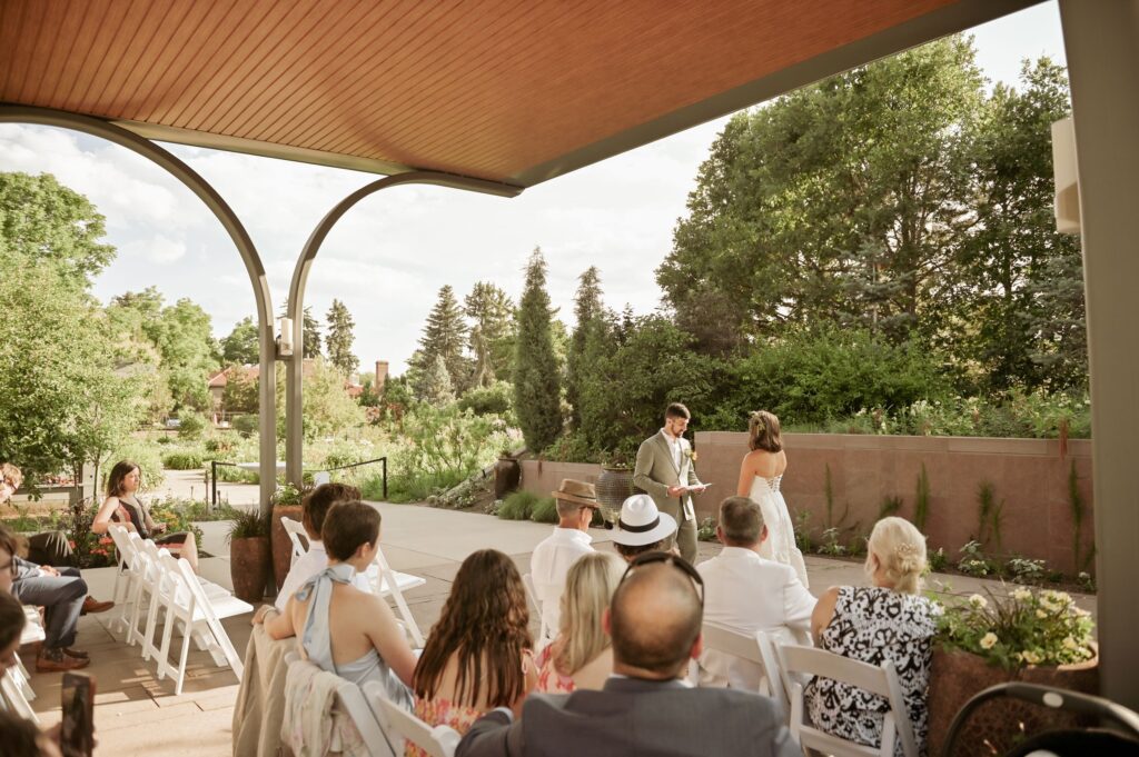 Outdoor Wedding Ceremony at Garden Venue with Guests