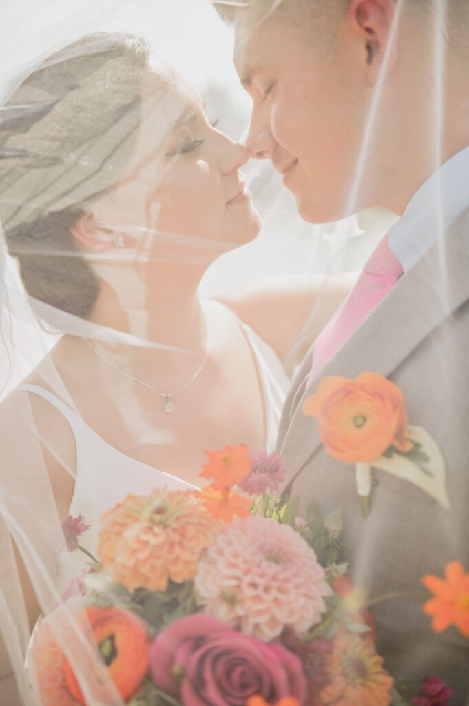 Bride and Groom under veil