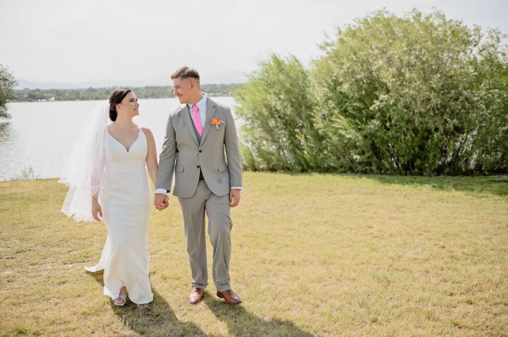 Bride and Groom Walking by the Lake