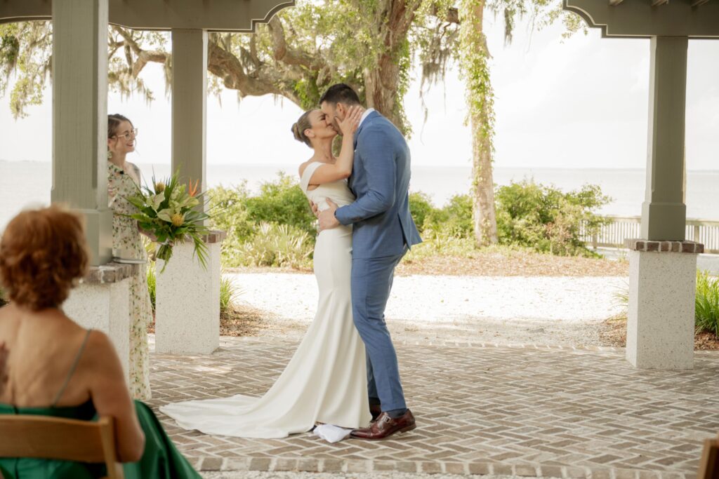 Bride and Groom sharing their first kiss