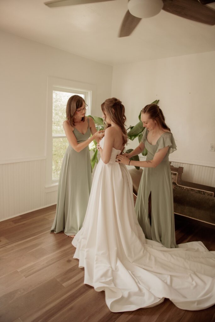 Bridesmaids Helping the Bride Get Ready