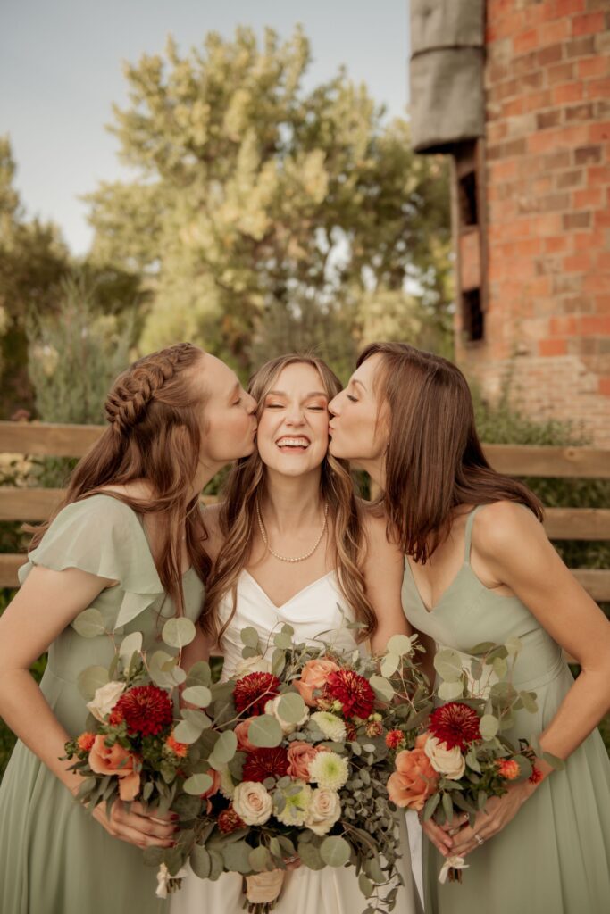 Bridesmaids Kissing the Bride
