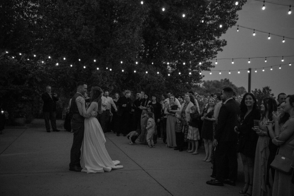 Couple Dancing Under String Lights