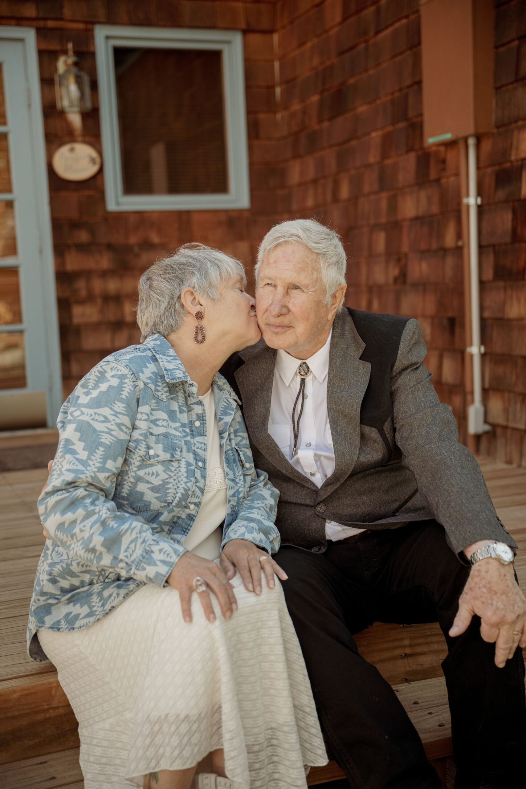 Couple Sharing a Kiss on the Porch