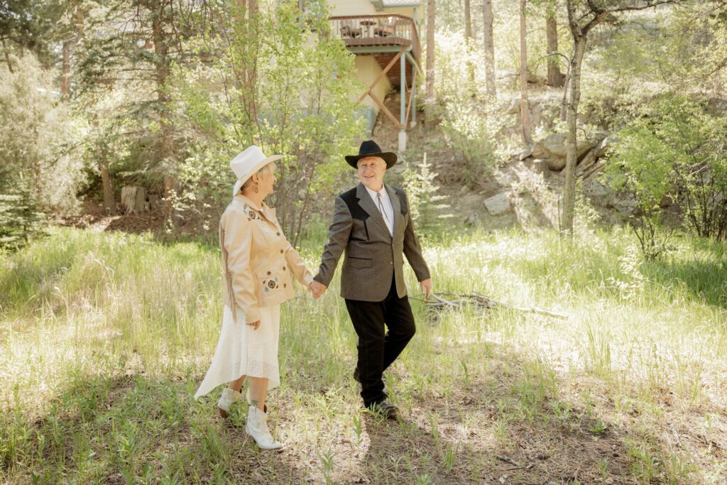 Couple Walking Through a Sunlit Meadow
