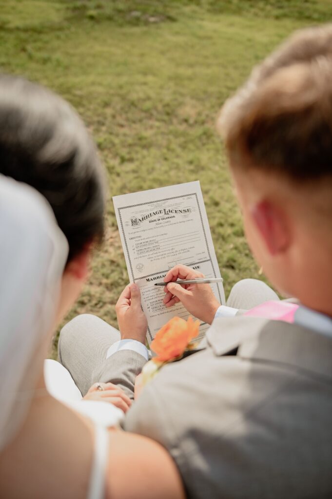 Bride and Groom signing wedding agreemnet