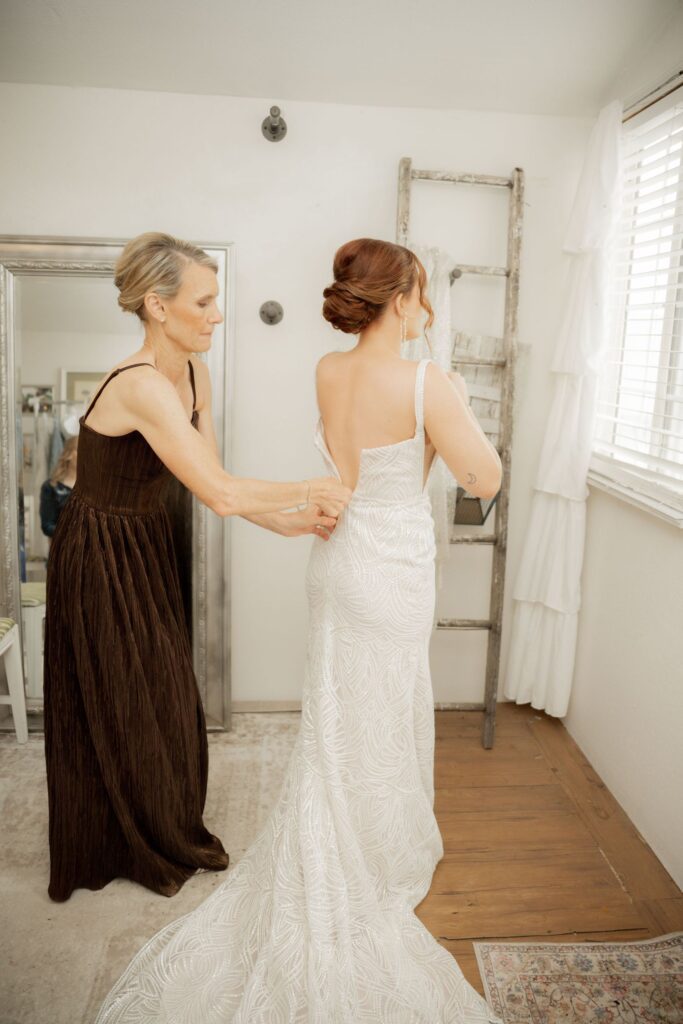 Bride adjusting dress