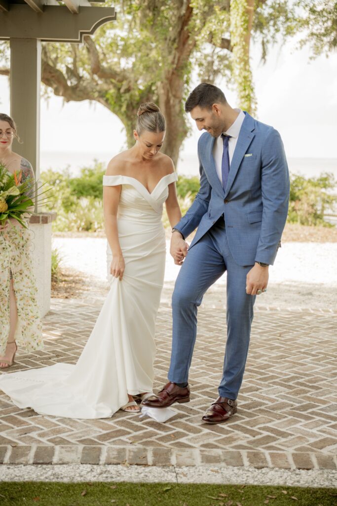Bride adjusting her dress