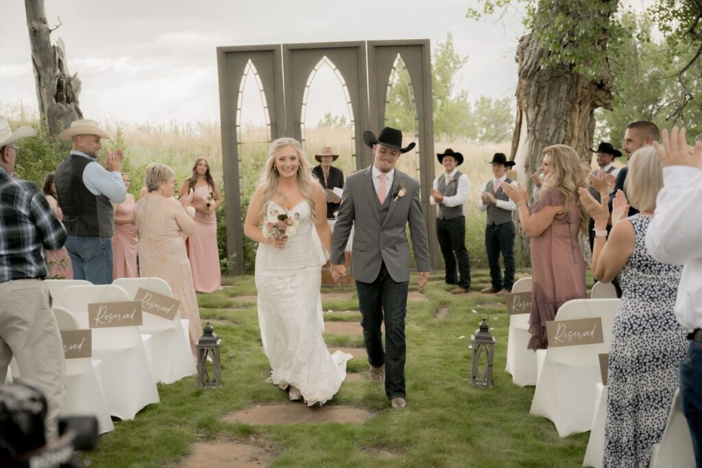 Bride and Groom walking down the aisle