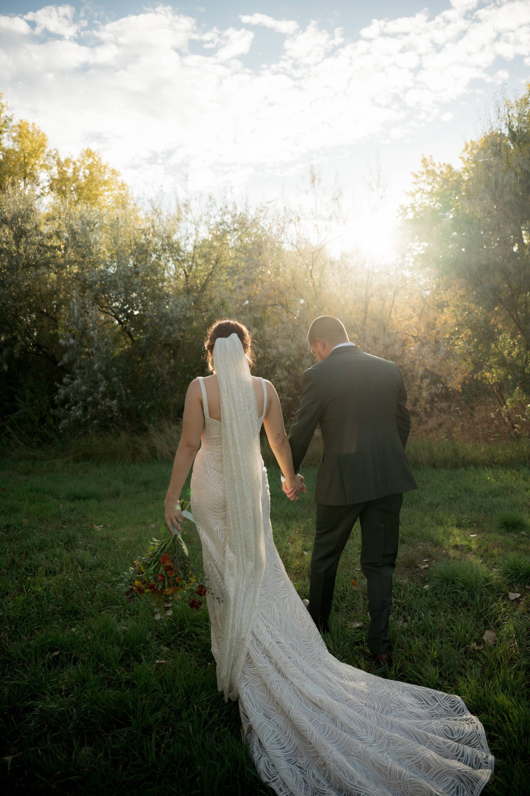Bride and groom walking hand in hand