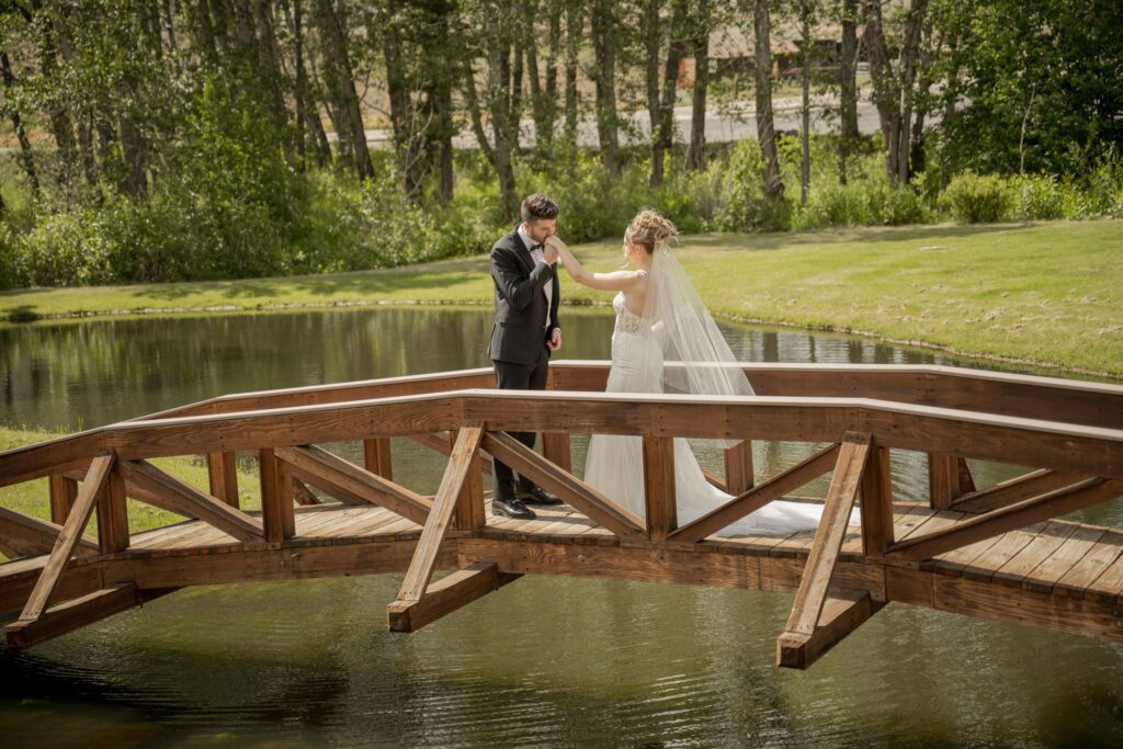 Bride and groom on a wodden bridge