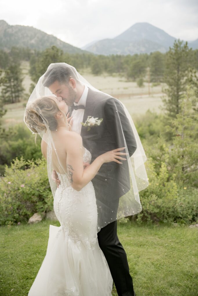 Bride and groom under the veil