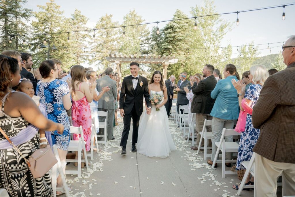 Bride and groom walking down the aisle