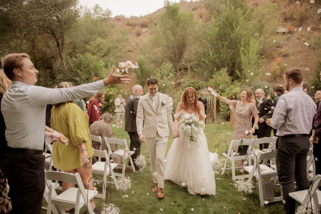 Bride and groom walking down the aisle