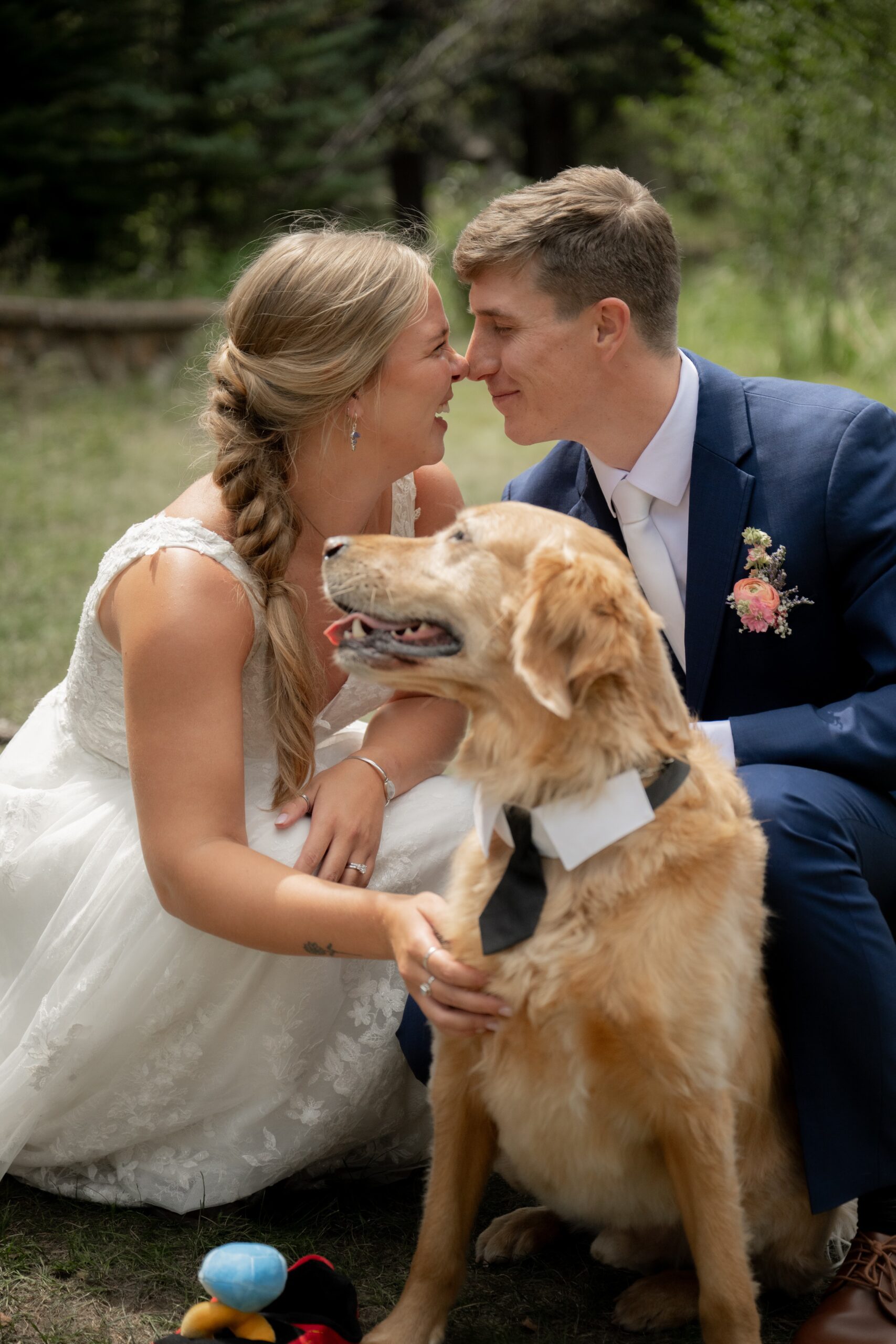 Bride and groom with their dog