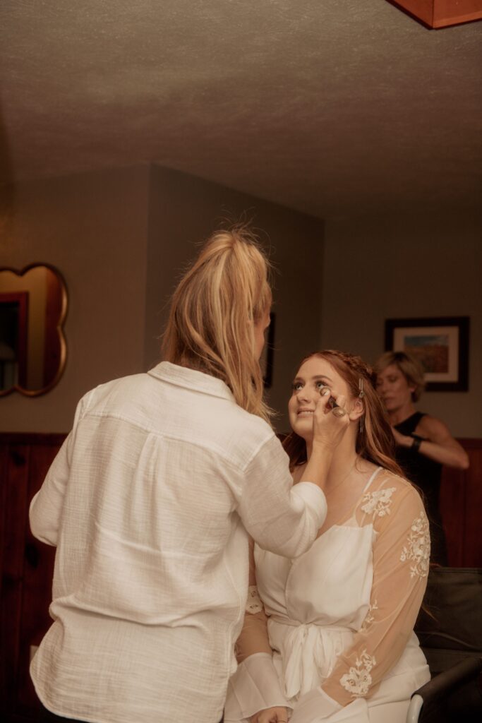Bride getting her makeup