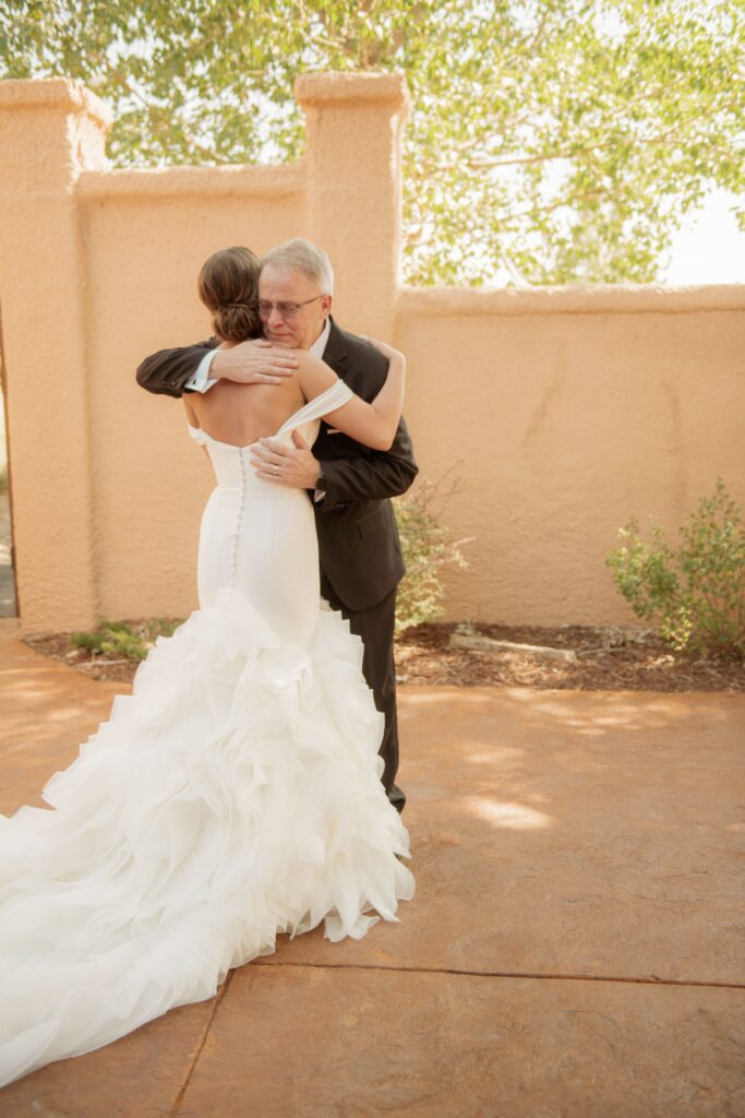 Bride hugging her father