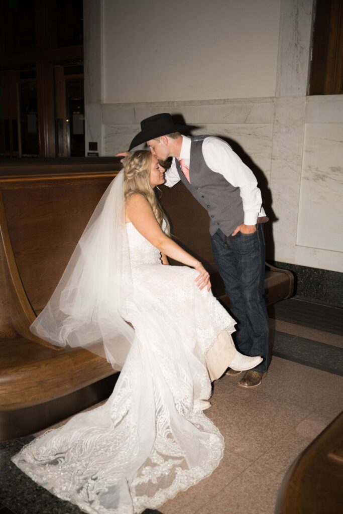 Groom kissing bride